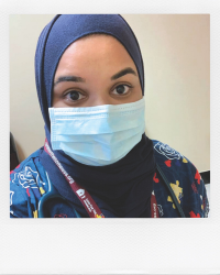 Nurse wearing face mask.